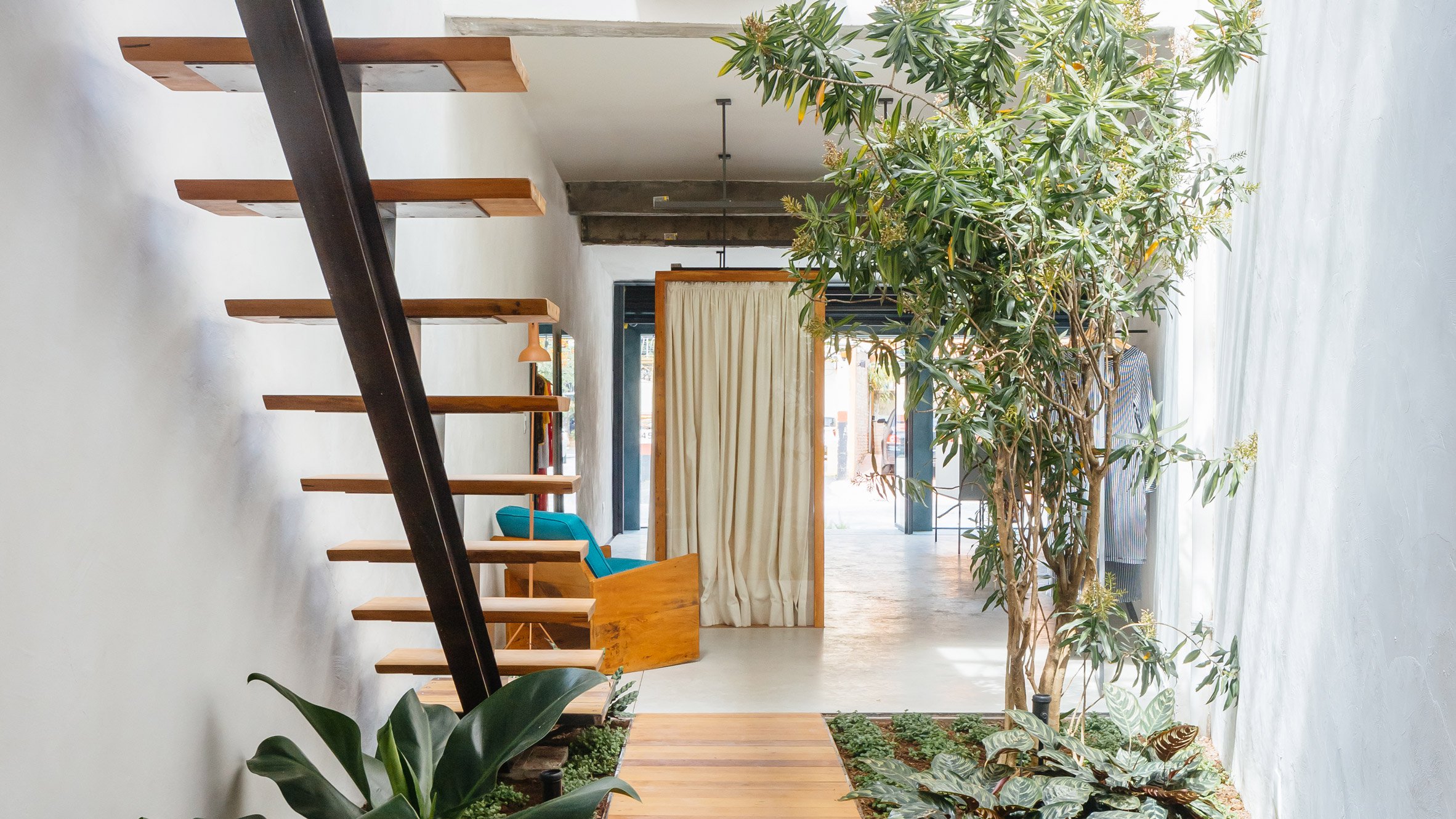 Vão Arquitetura designed a boutique around a luxuriant indoor garden